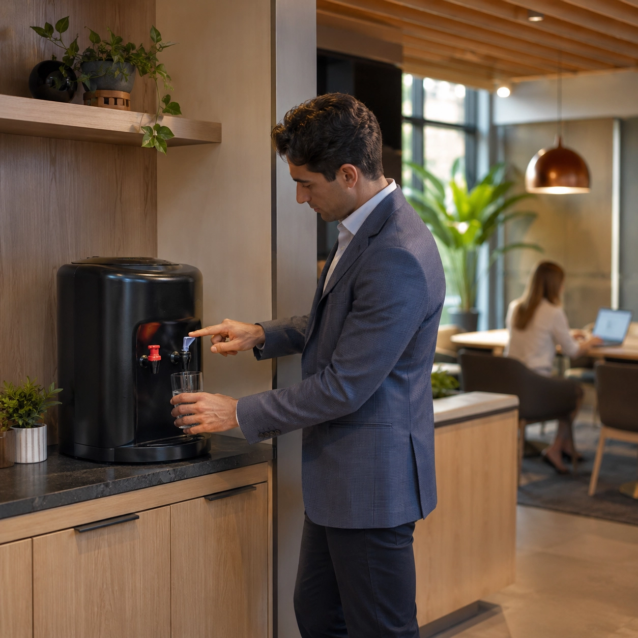 Crystal Mountain AVALANCHE bottleless water cooler installed in a modern office breakroom.